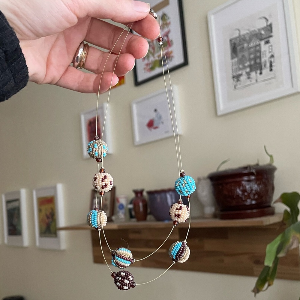 Double stranded beaded necklace in blue cream brown